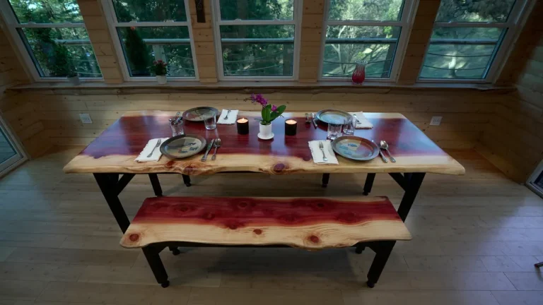 Redwood table in a rustic cabin environment ready for a meal