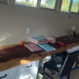 18 foot redwood desktop has been installed in a home office