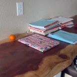 18 foot redwood desktop has been installed in a home office