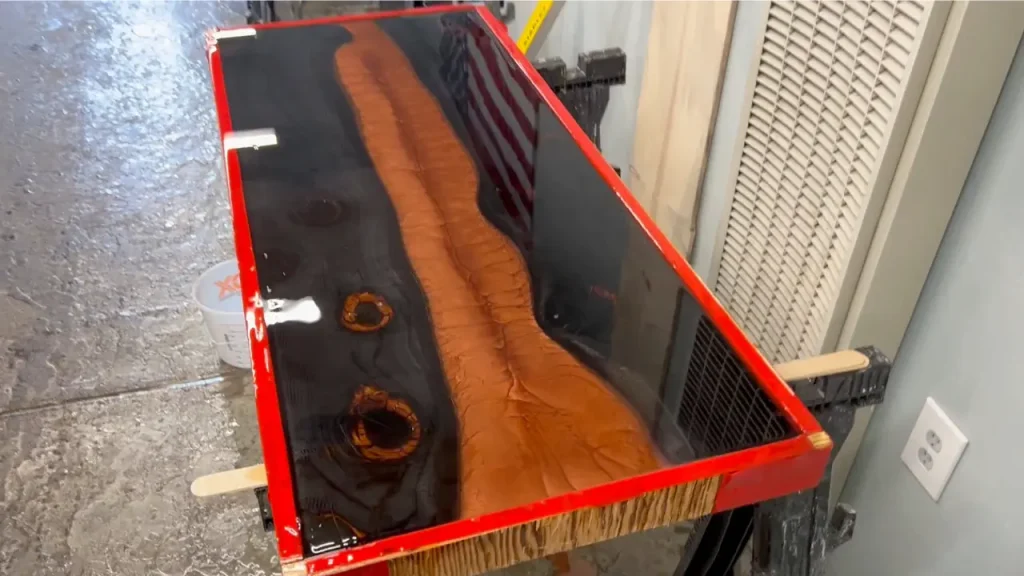 Lava table with red resin pour
