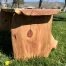 Redwood bench sitting in the grass