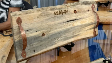 pine charcuterie board with a laser etching of a grapevine pine charcuterie board with a laser etching of a grapevine