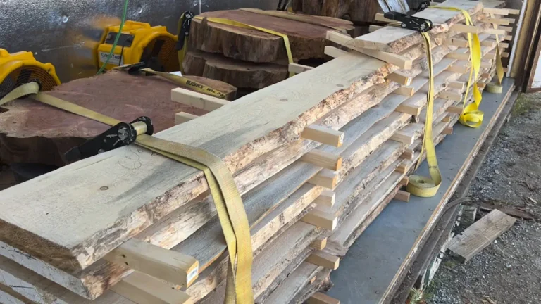 The planks are secured and strapped with spacers for air flow, and set to dry. The stack is flipped and rotated once a week for even curing