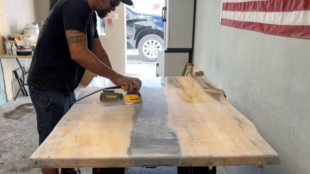 The wet sanding process helps ensure a uniform finish across the entire kitchen.